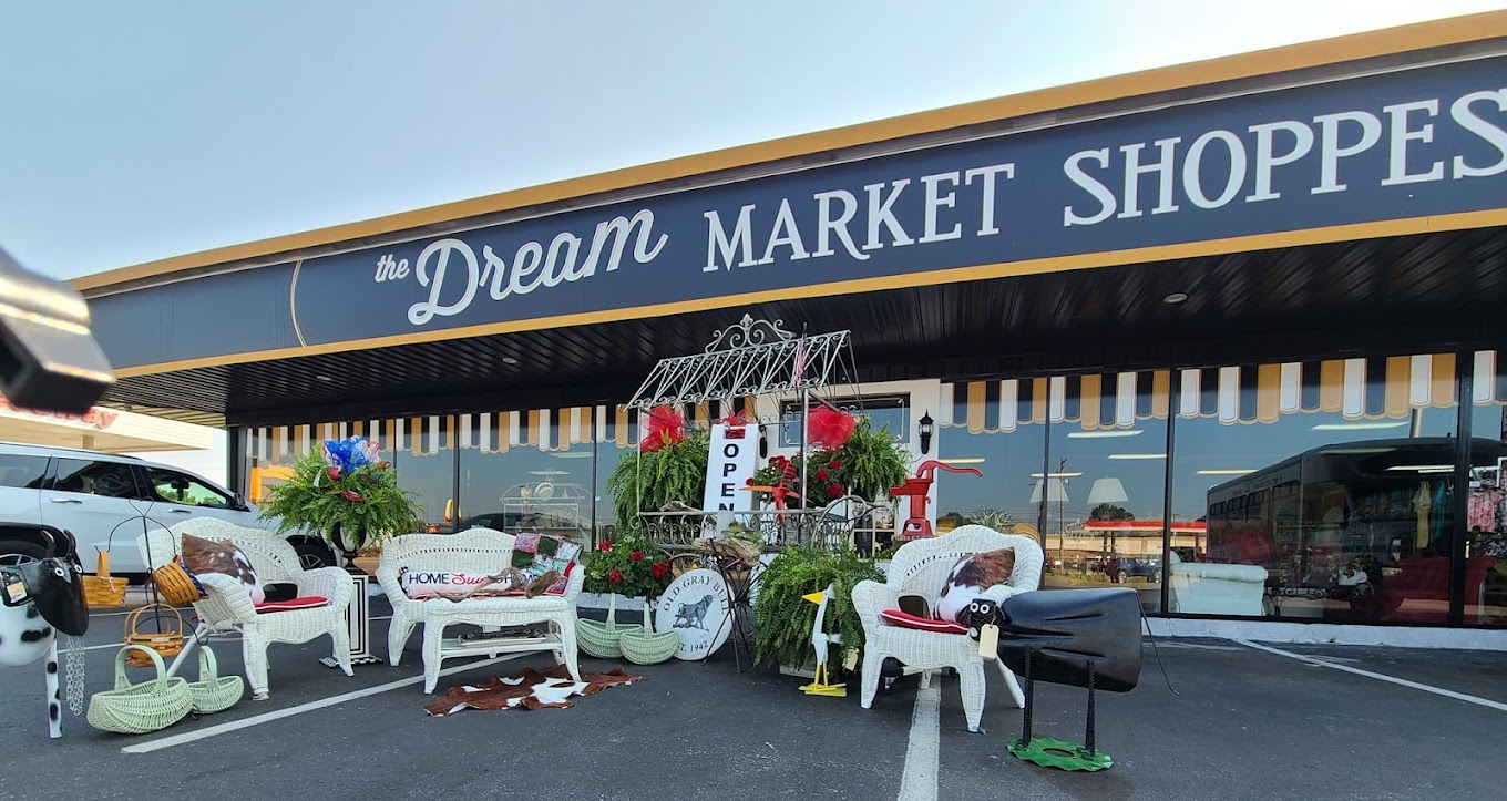 Warm interior of The Dream Market Shoppe with vintage booths and golden lighting